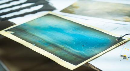 A model representation of the painterly blue backdrop that will be on the back of the stage