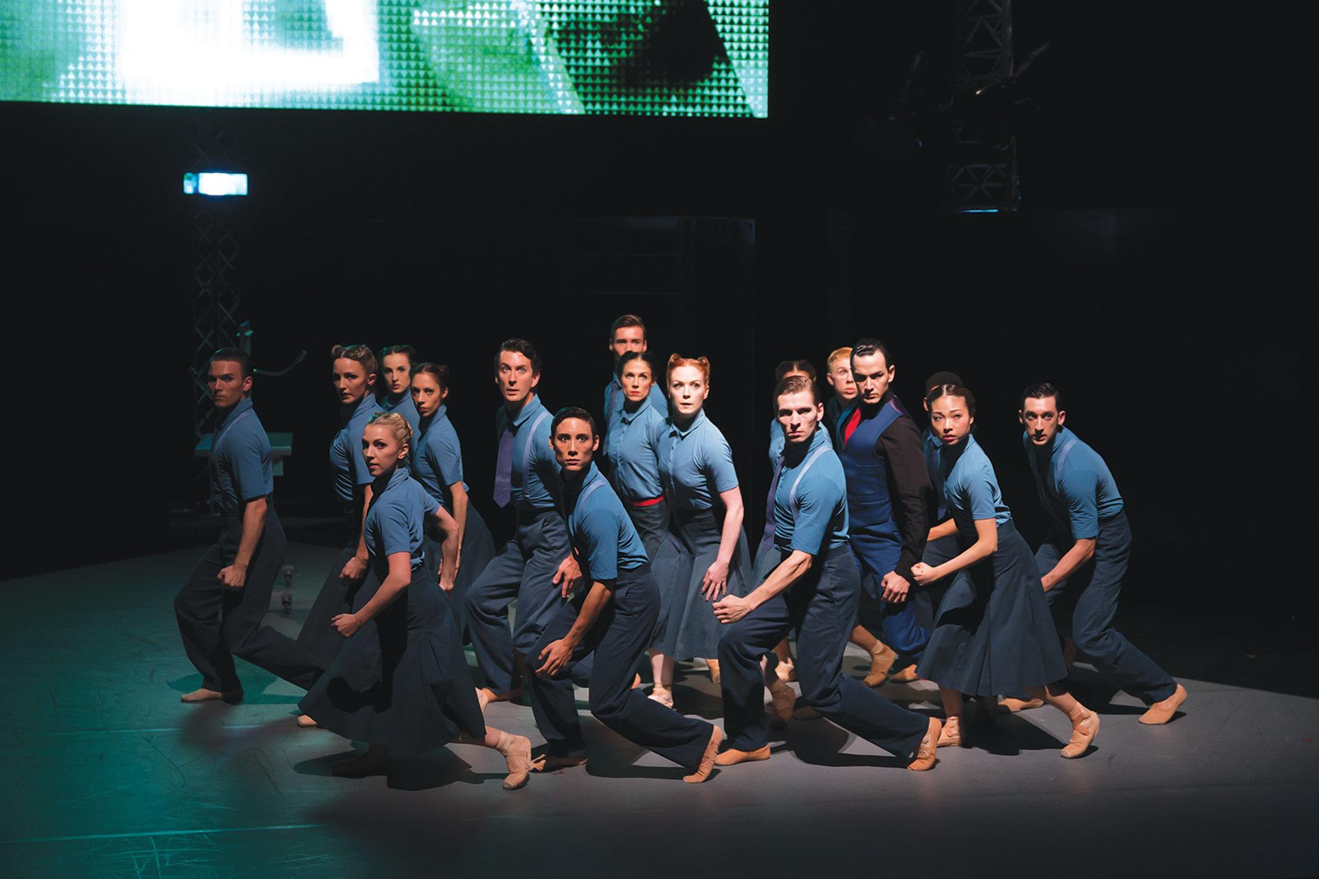 1984, production, 2015, Northern Ballet dancers, photo Emma Kauldhar Members of the party move in unison under the instruction of Big Brother