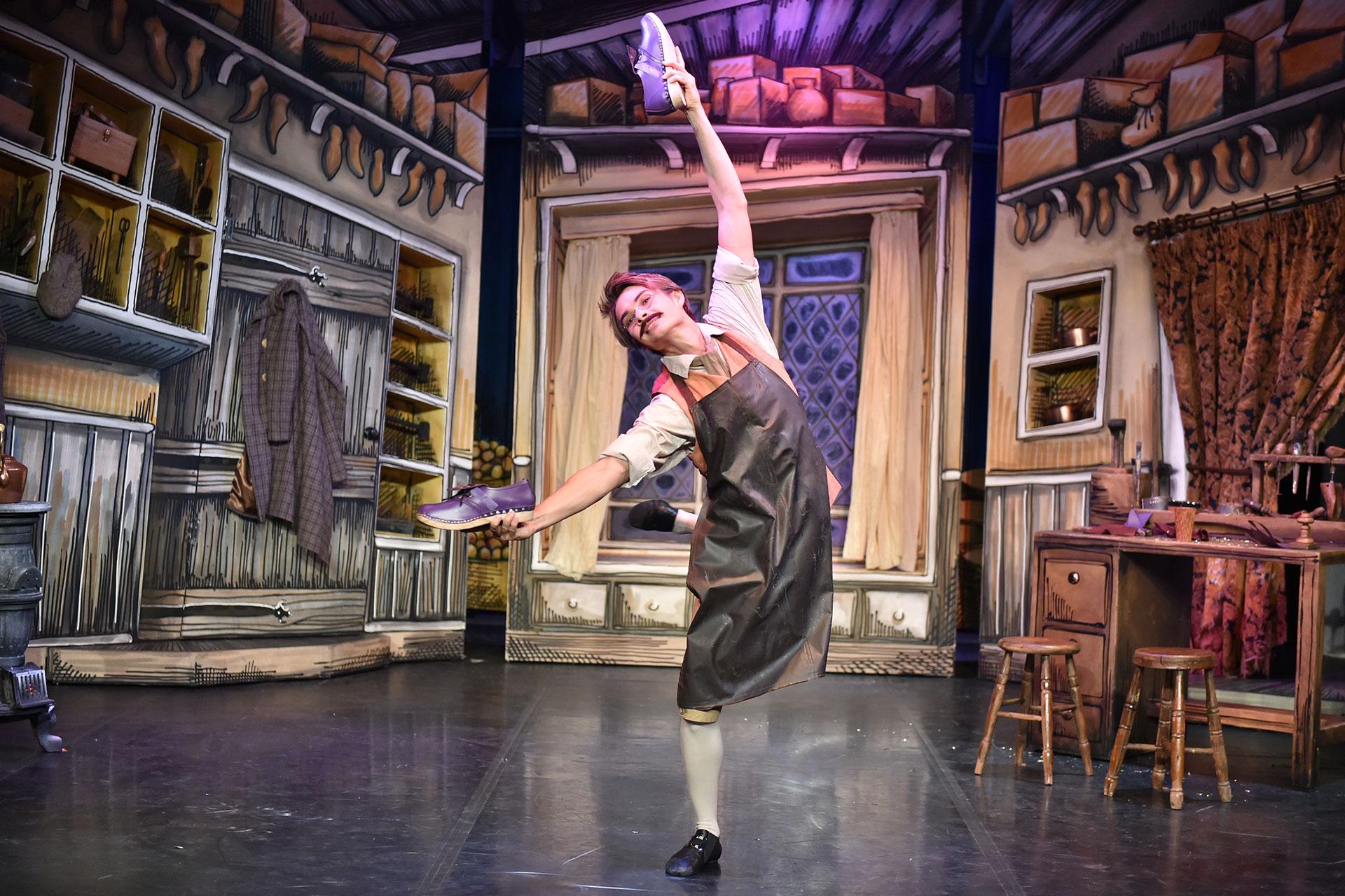 Elves & the Shoemaker, production, 2014, Sebastian Loe as Bertie, photo Brian Slater Bertie is thrilled to find new shoes made to perfection in his workshop, but by whom?