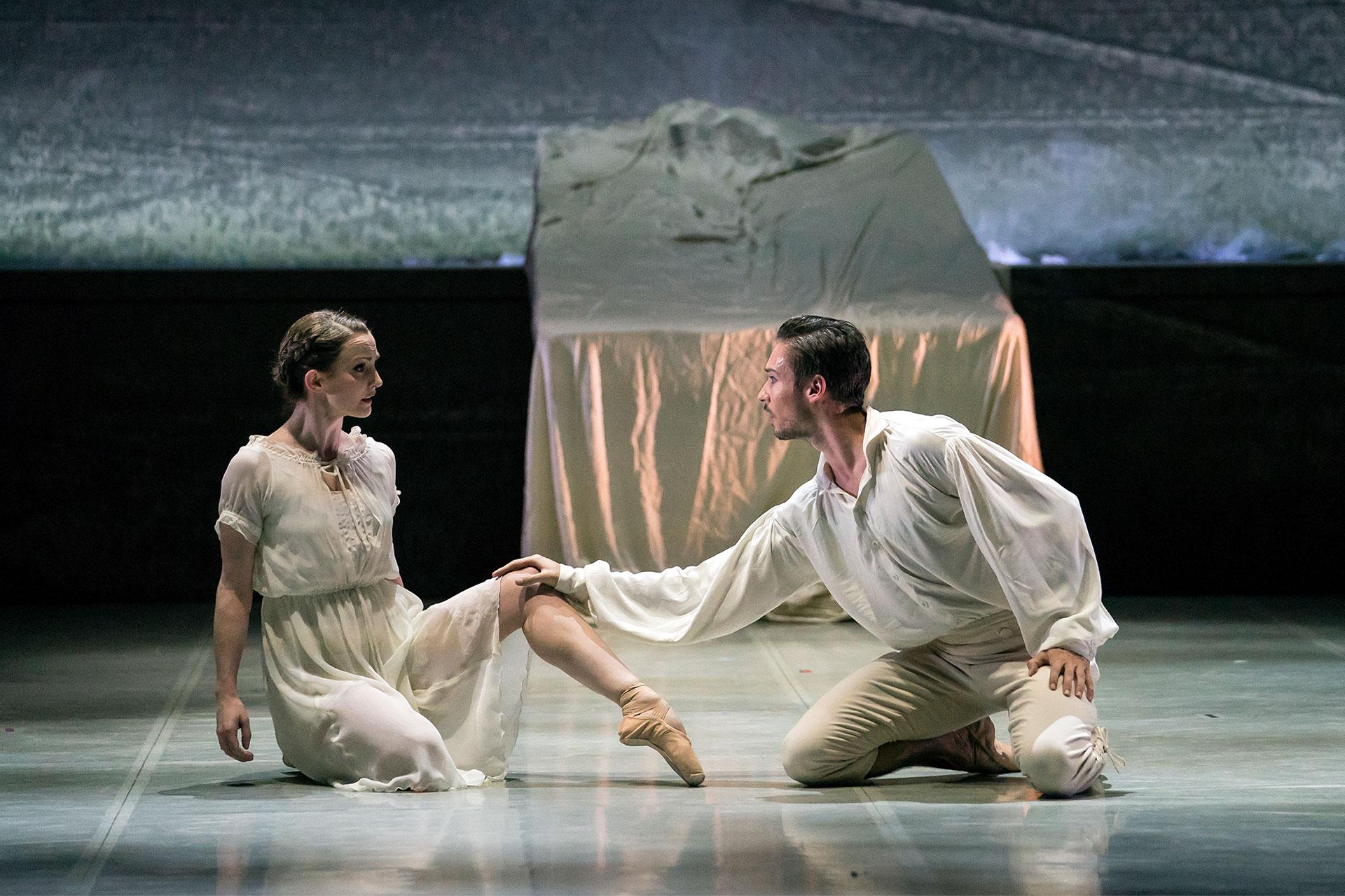 Jane and Rochester kneel in her bedroom facing each other, he has a hand on her knee