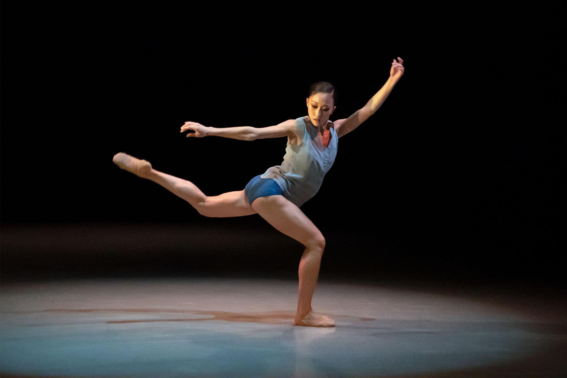 Minju Kang on one leg with the other reaching back