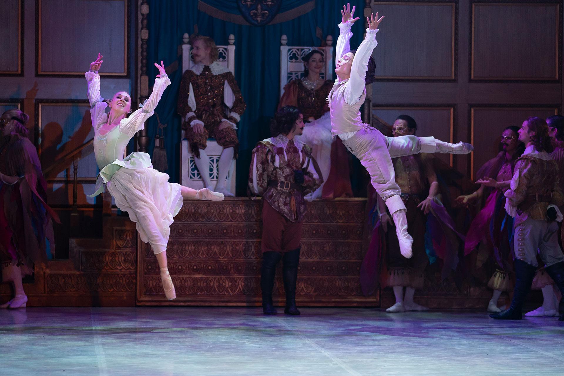 Constance and d'Artagnan jump in celebration at Court