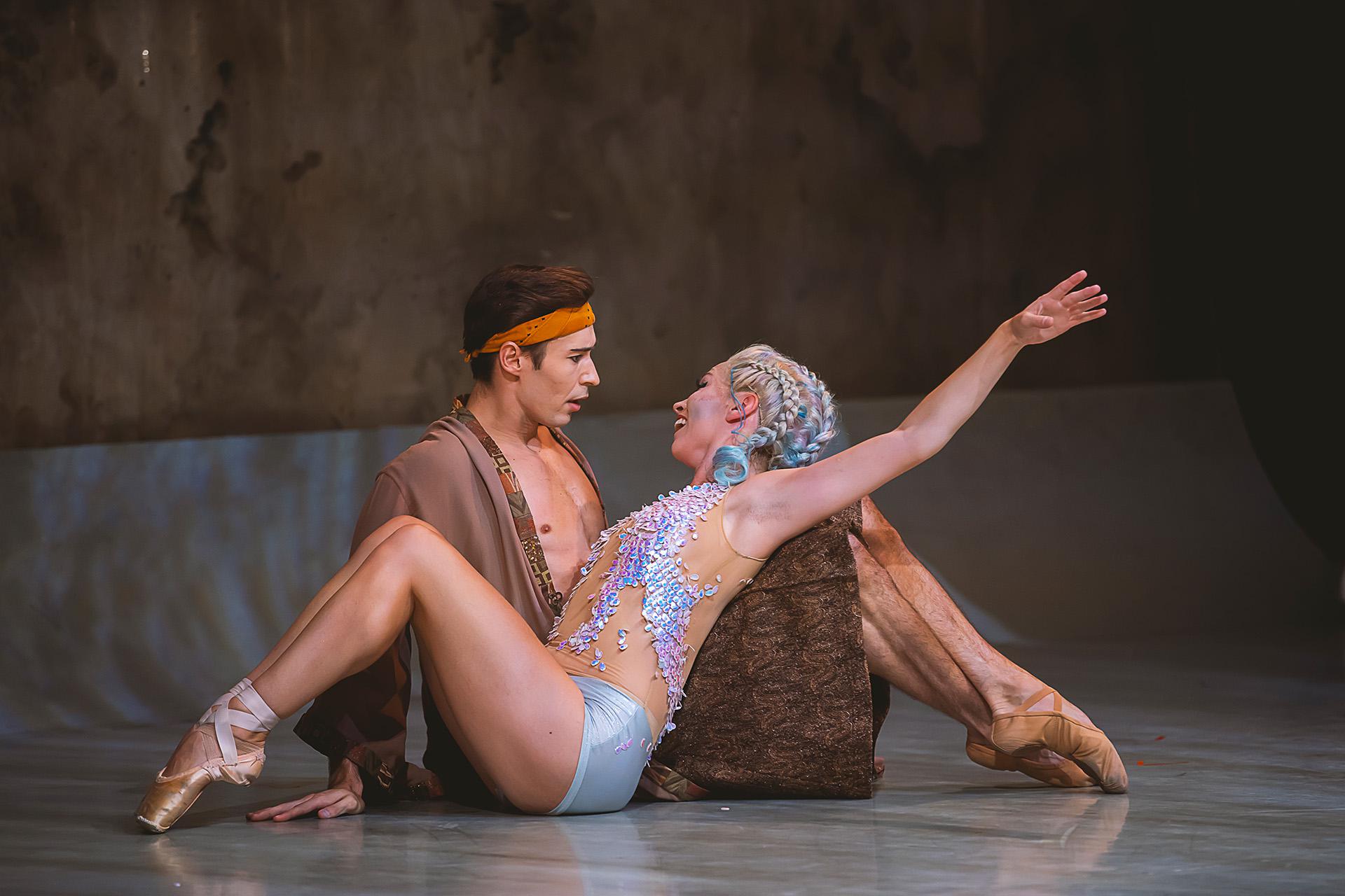The Little Mermaid, production, 2022, Abigail Prudames and Joseph Taylor. Photo Emily Nuttall Prince Adair sits in shock as a newly legged Marilla leans against his legs