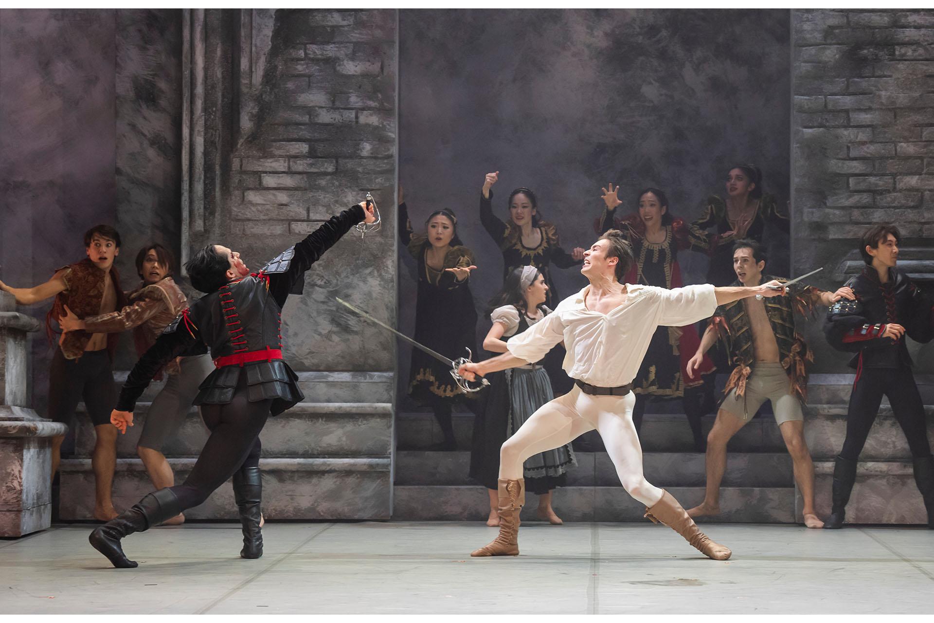 Harry Skoupas and Joseph Taylor in Romeo and Juliet. Photo Tristram Kenton Two dancers with swords jousting on stage