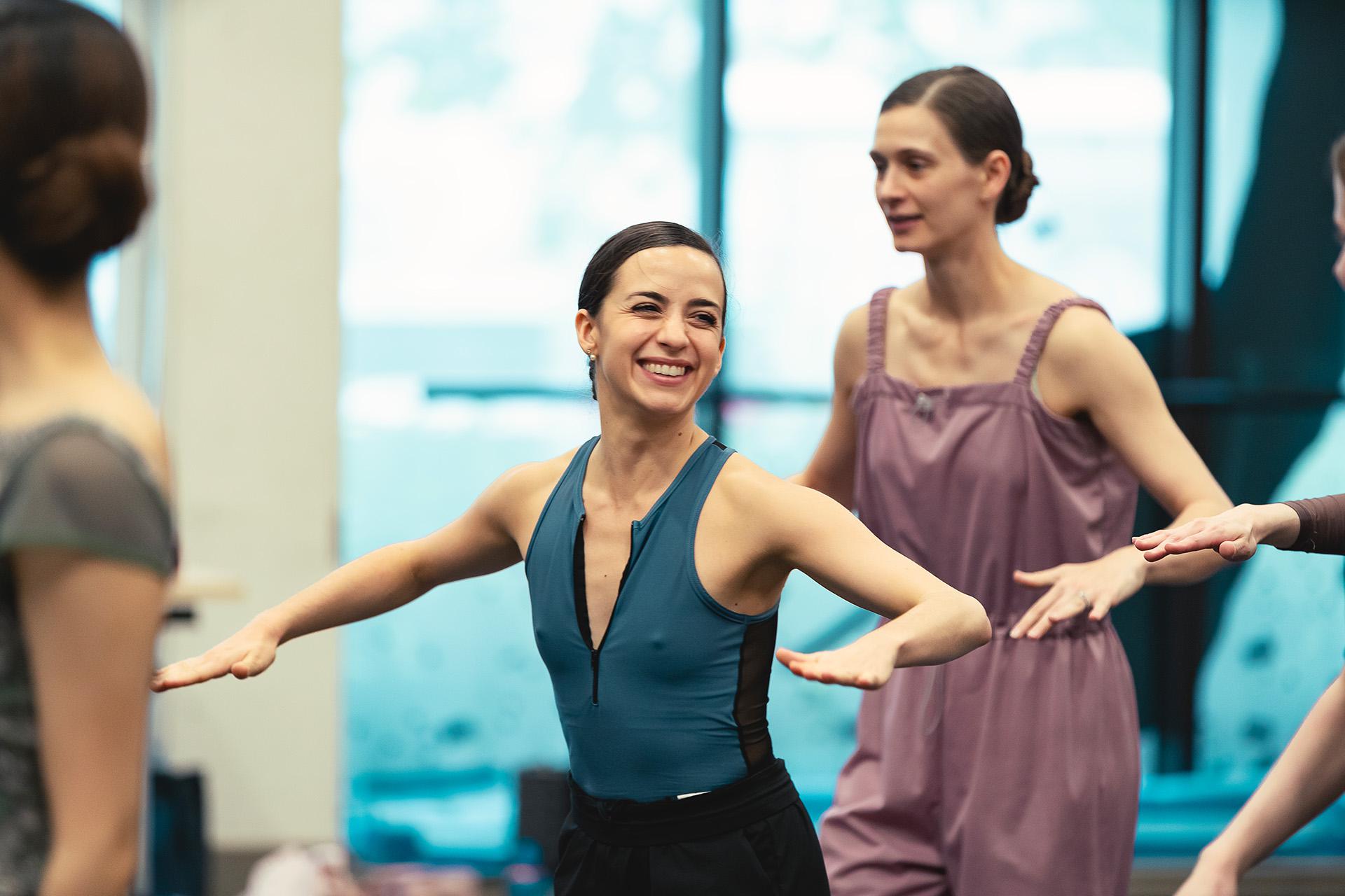Smiling dancer poses during rehearsals
