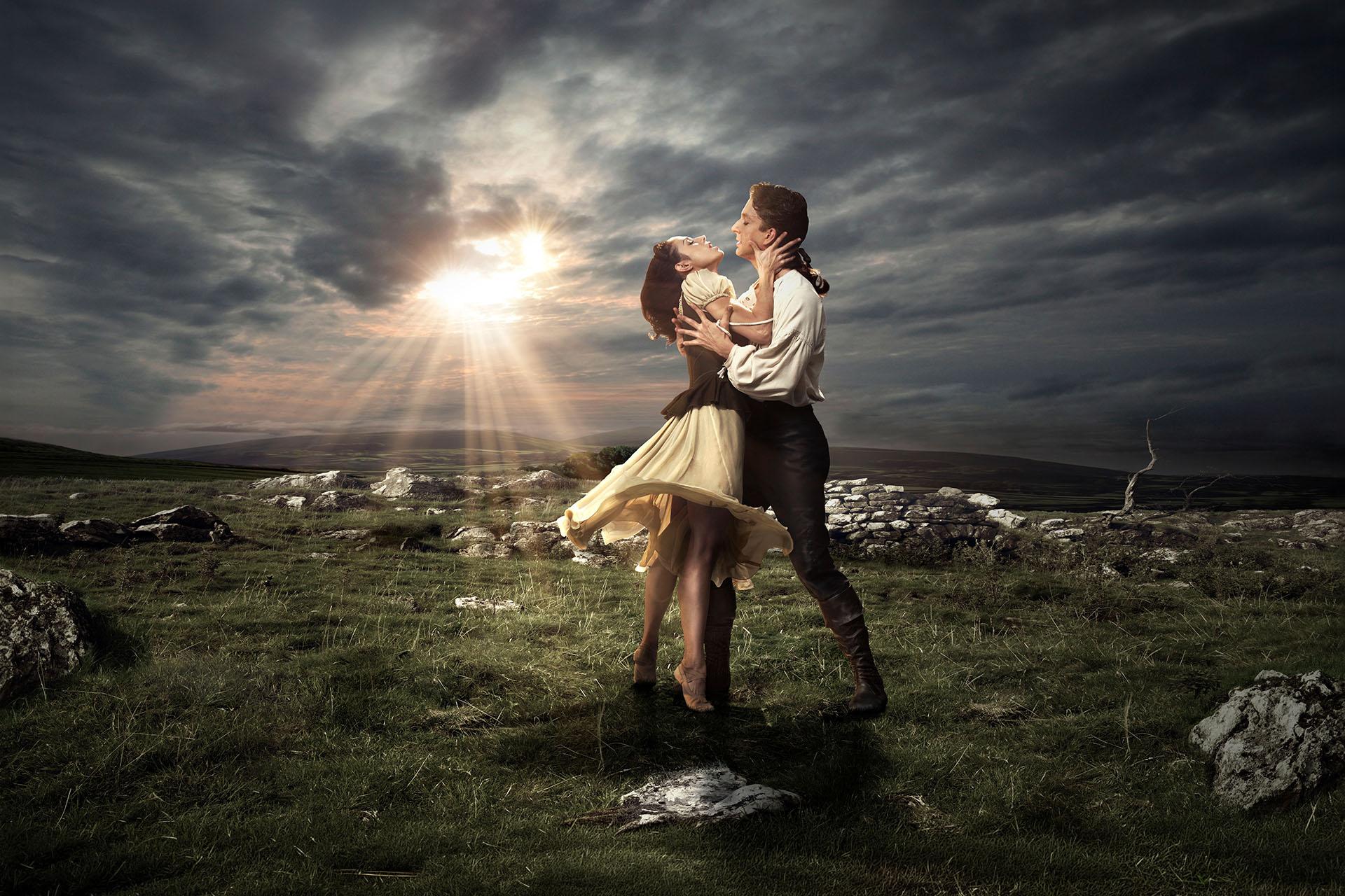 Cathy stands on her toes, reaching to Heathcliff in one of our publicity images