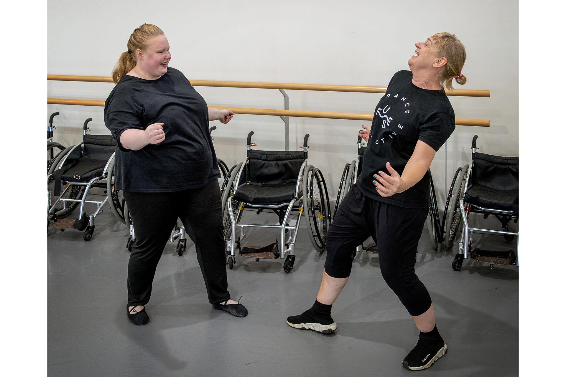 Two women dancing joyously