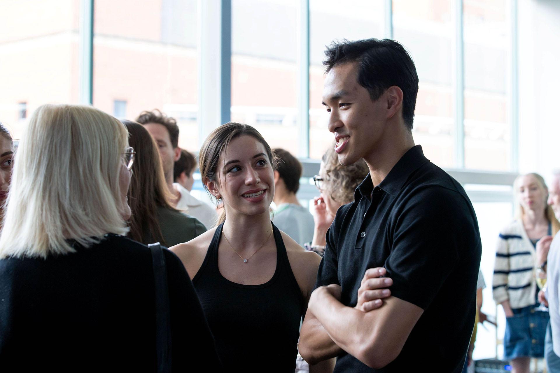 Two Northern Ballet dancers meeting a benefactor in a studio at Northern Ballet's home.