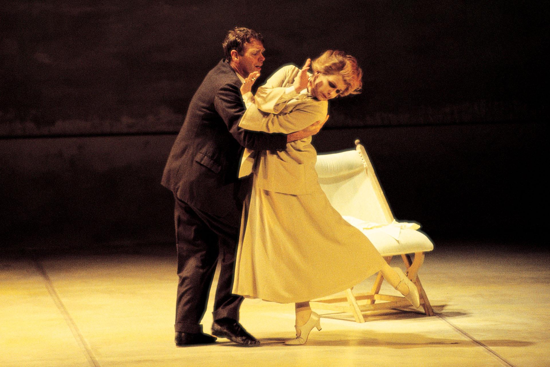 Lowry, played by Christopher Gable embraces his mother, played by Lynne Seymour, as she shields against him