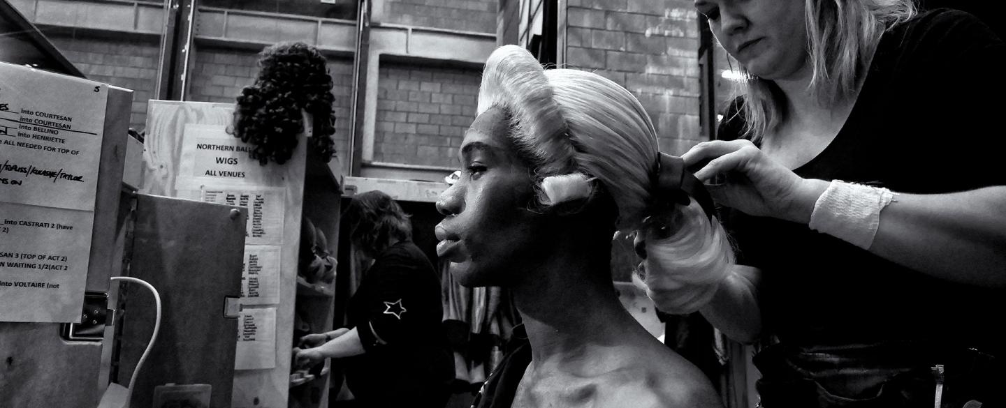 Wigs manager Harriet Rogers fixed Mlindi Kulashe's wig in place before a performance of Casanova. Photo Simon Lee.
