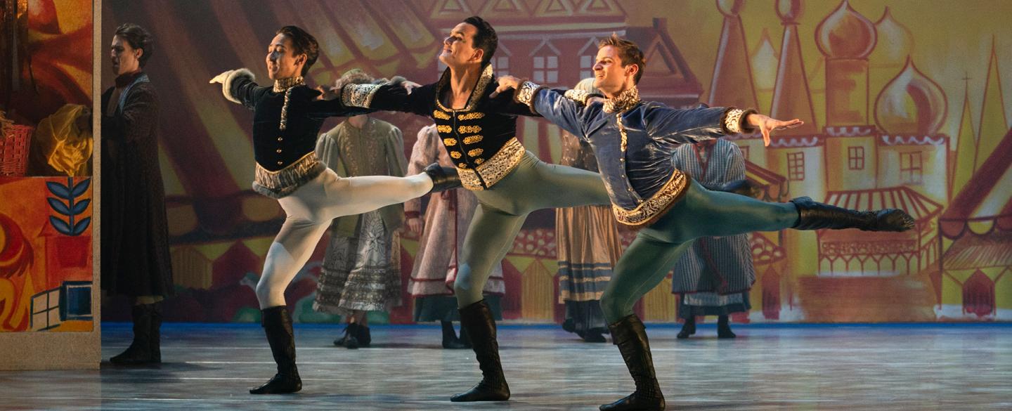 Northern Ballet dancers Riku Ito, Javier Torres and Nicola Gervasi dancing with joy in Cinderella. Photo Emma Kauldhar.