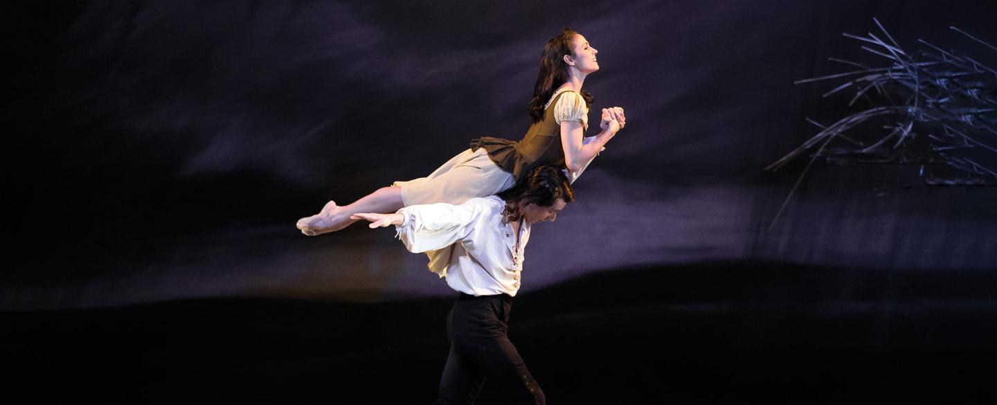 Heathcliff carrying Cathy on the moors with Cathy having perfect extension.