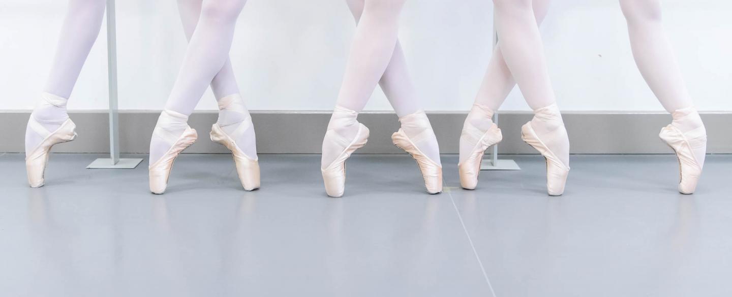 Four dancers stood on pointe