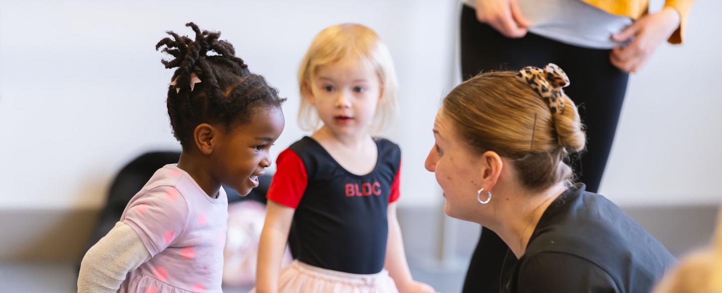 A teacher speaking to a young student
