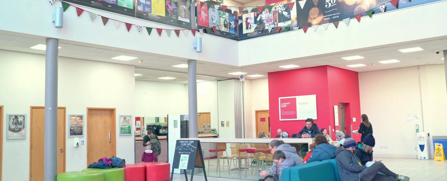 The Northern Ballet atrium with people sat