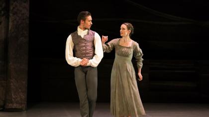 Jane Eyre reaches for Rochester's arm