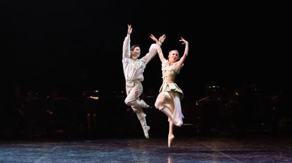Two dancers leap in the air in a scene from The Three Musketeers
