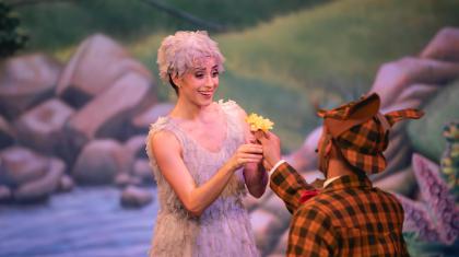 A dancer being given a flower 