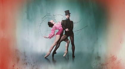 Wearing a black top hat and pointe shoes, the character of Gentleman Jack looks directly at the camera hands on a cane, a woman in pink hold onto her and leans back suggestively